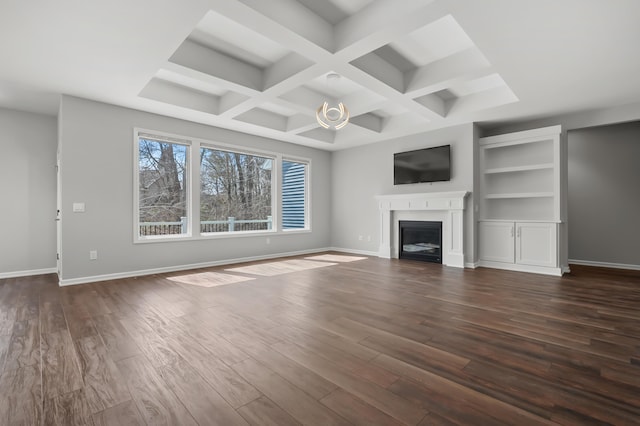 4030 Hollow Wood Dr, Portage, MI 49024 - unfurnished living room with dark wood finished floors, baseboards, and a fireplace