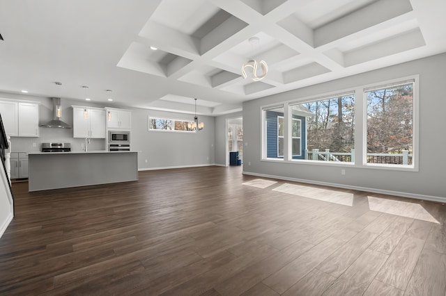 4030 Hollow Wood Dr, Portage, MI 49024 - unfurnished living room featuring baseboards, coffered ceiling, dark wood-type flooring, and a notable chandelier