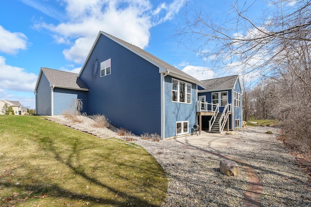 4030 Hollow Wood Dr, Portage, MI 49024 - view of side of property with stairs, a patio, and a lawn