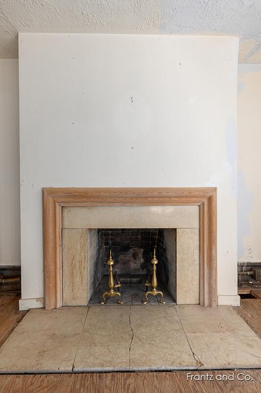 room details featuring a textured ceiling and a fireplace