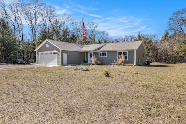 single story home featuring a front yard and an attached garage