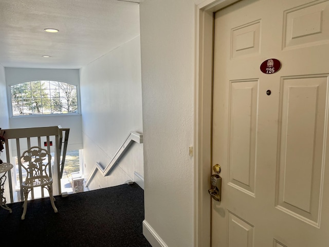 stairway featuring recessed lighting and baseboards