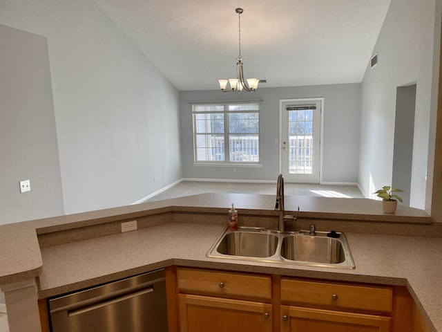 kitchen featuring visible vents, a sink, stainless steel dishwasher, open floor plan, and vaulted ceiling