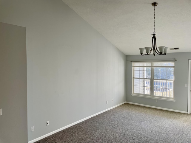 interior space featuring carpet, visible vents, baseboards, and a chandelier