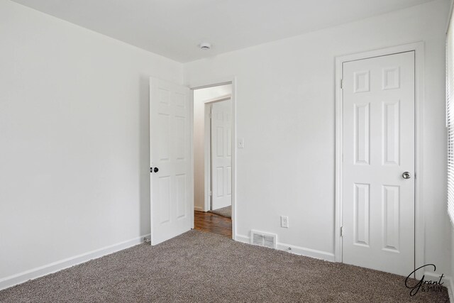11620 Rossiter St, Detroit, MI 48224 - unfurnished bedroom with visible vents, baseboards, and carpet flooring