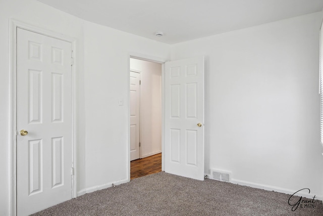 11620 Rossiter St, Detroit, MI 48224 - unfurnished bedroom featuring carpet, visible vents, and baseboards