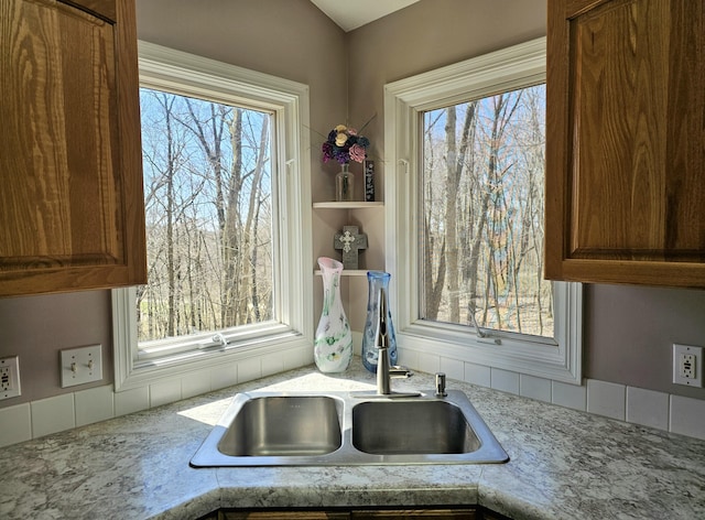 details with a sink and brown cabinets
