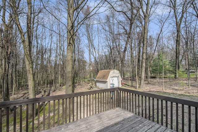 deck with an outdoor structure and a storage shed