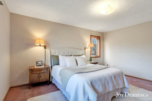 bedroom with carpet and baseboards