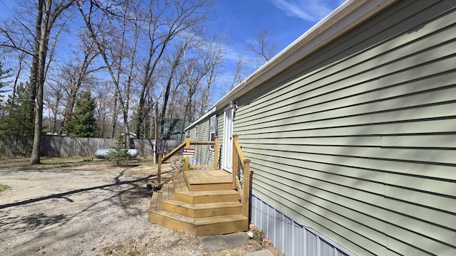 view of property exterior with fence