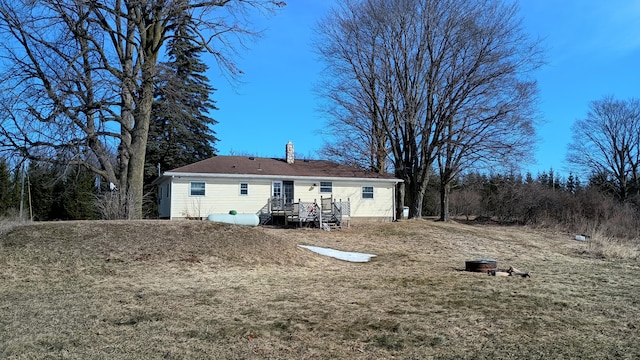 back of property featuring a chimney