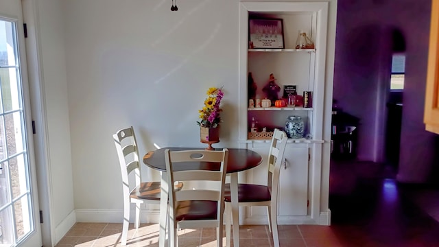 tiled dining space with baseboards