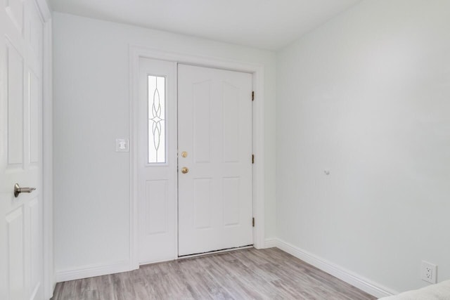 entrance foyer featuring baseboards and light wood-style flooring