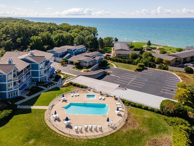 birds eye view of property featuring a water view