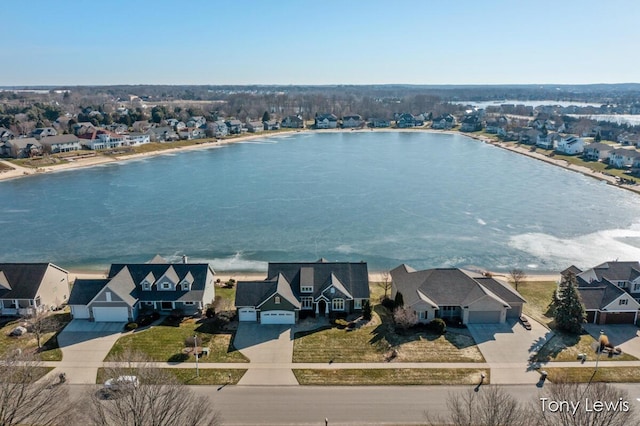 aerial view featuring a residential view and a water view