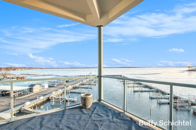 balcony featuring a water view