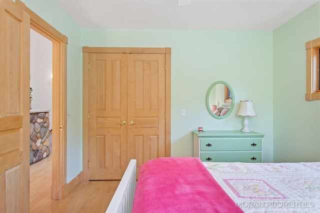 bedroom featuring a closet and wood finished floors