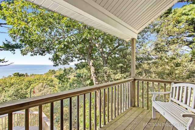 wooden terrace with a water view