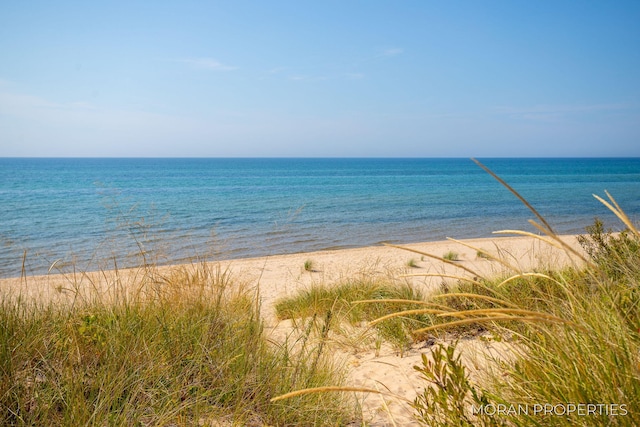 view of water feature with a beach view