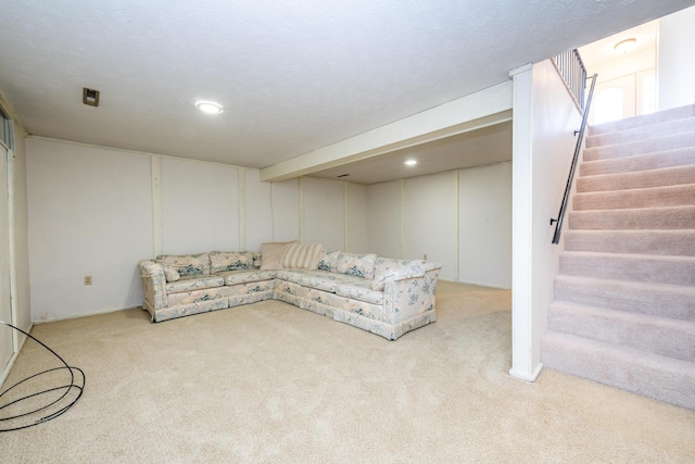 living area featuring stairway and carpet floors