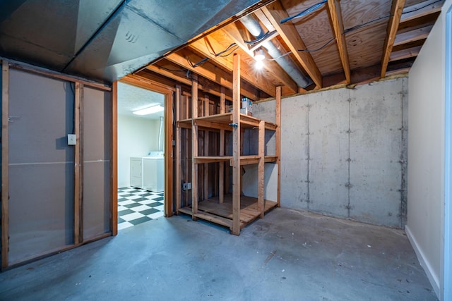 unfinished basement featuring washer and dryer