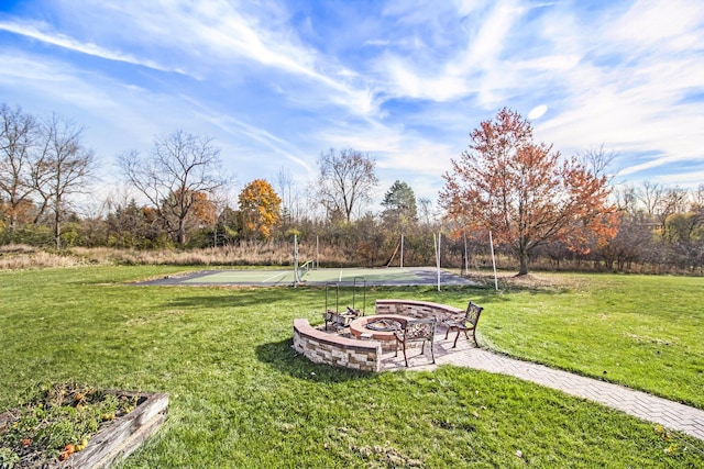 view of yard featuring an outdoor fire pit