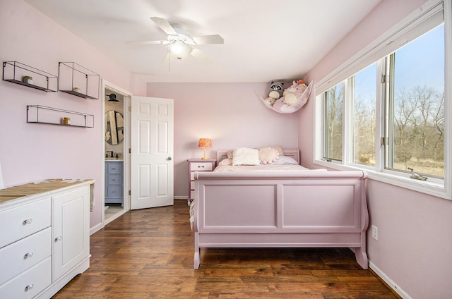 bedroom with ceiling fan, baseboards, and dark wood-style floors