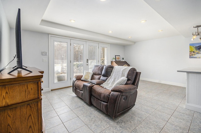 living room featuring light tile patterned floors, recessed lighting, and baseboards