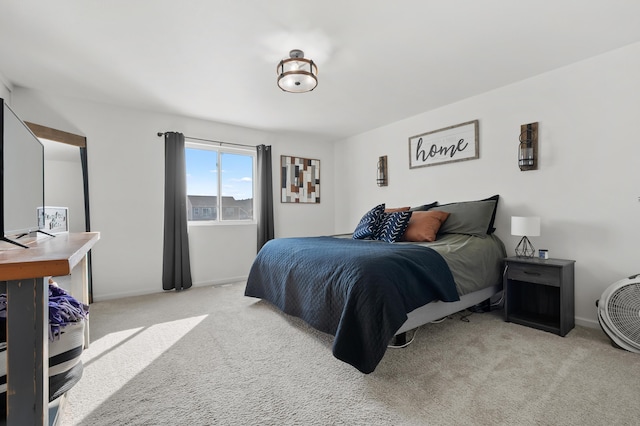 bedroom with baseboards and carpet flooring