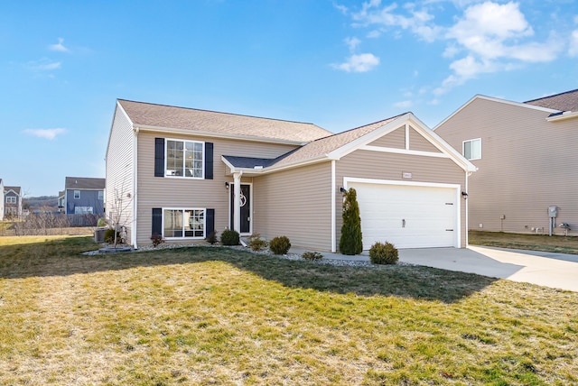 view of front of home featuring driveway, a front lawn, and an attached garage