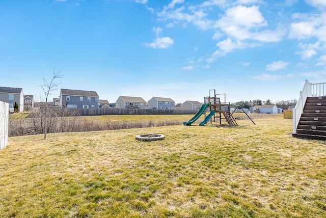 view of yard with a residential view and a playground