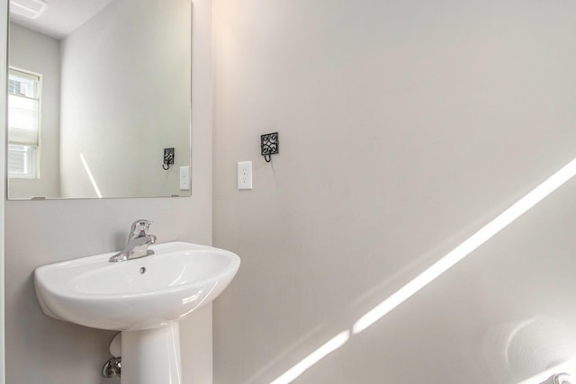 bathroom featuring a sink and visible vents