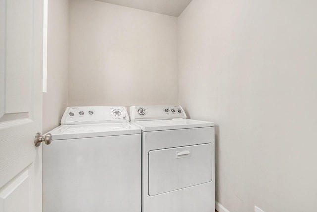 laundry room featuring washer and clothes dryer and laundry area