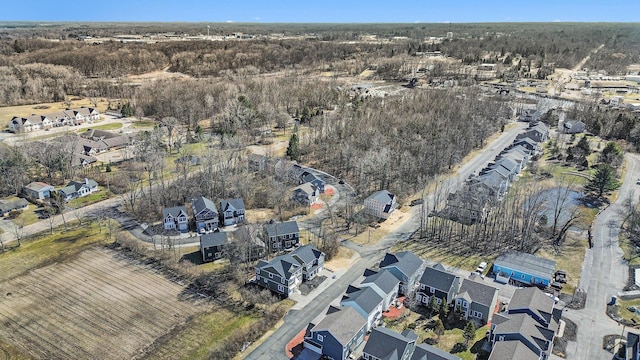 aerial view featuring a residential view and a forest view