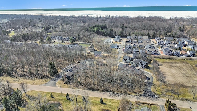 birds eye view of property featuring a residential view and a water view