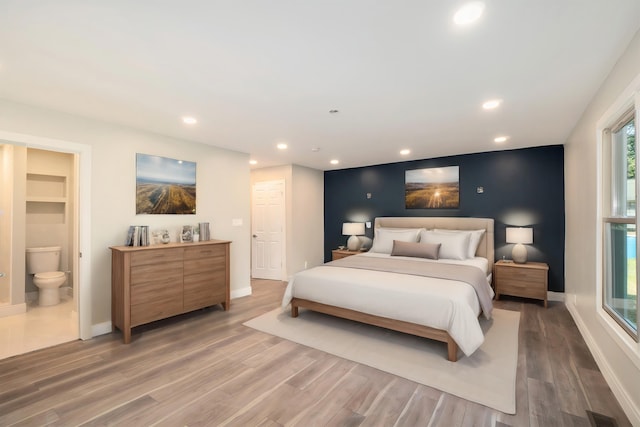 bedroom featuring recessed lighting, light wood-style flooring, baseboards, and visible vents