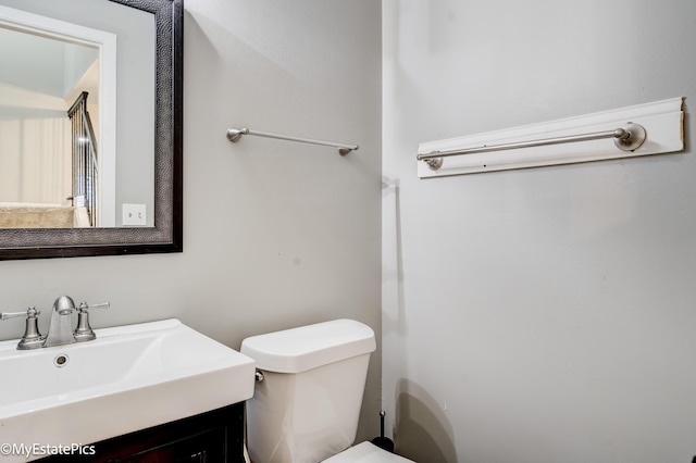 bathroom featuring toilet and a sink