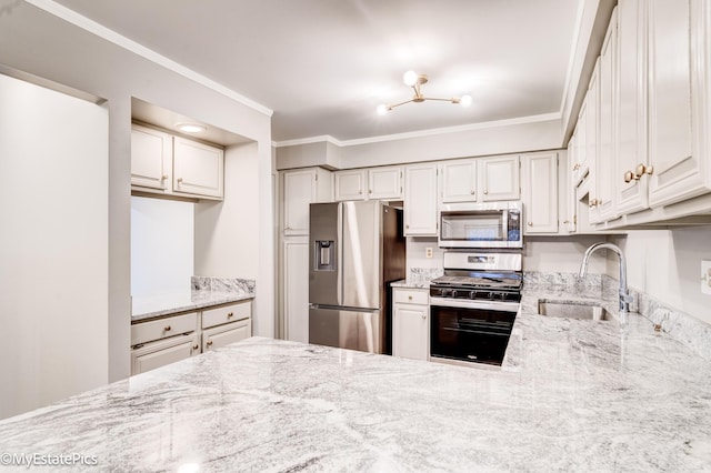 kitchen with crown molding, light stone counters, appliances with stainless steel finishes, and a sink