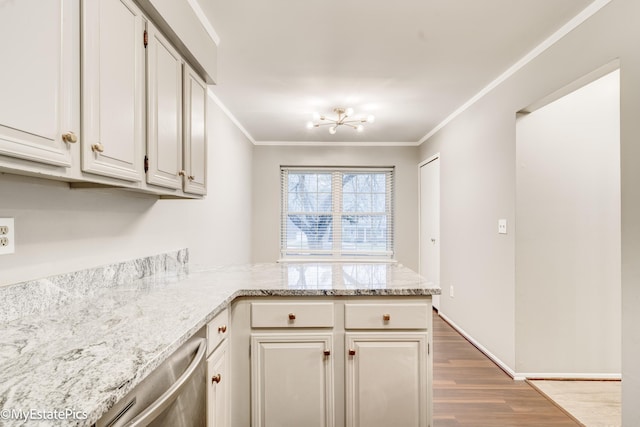 kitchen with wood finished floors, light stone countertops, a peninsula, stainless steel dishwasher, and crown molding