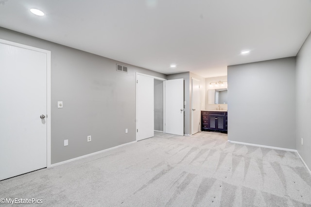 unfurnished bedroom featuring recessed lighting, visible vents, carpet flooring, and baseboards