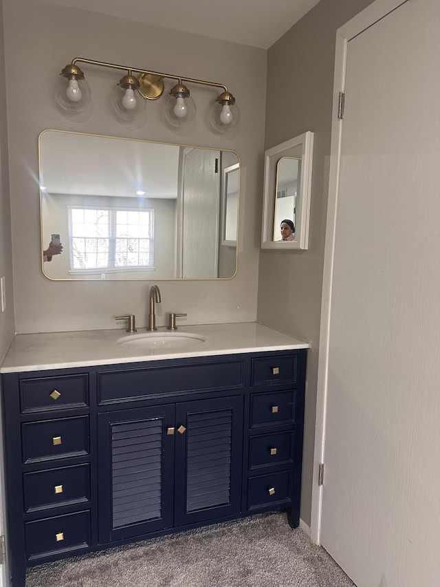 bathroom featuring washer / clothes dryer and vanity