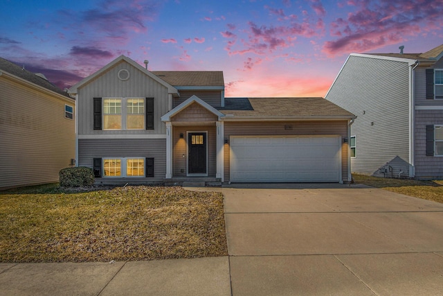 view of front of home with concrete driveway, an attached garage, and board and batten siding