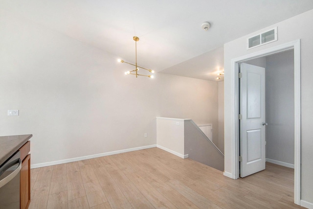 interior space with visible vents, baseboards, and light wood-style flooring