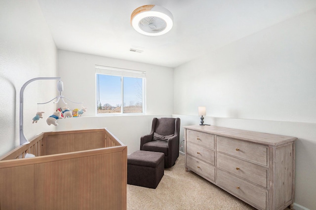 bedroom featuring light carpet