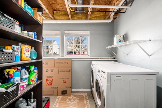 clothes washing area with laundry area and separate washer and dryer