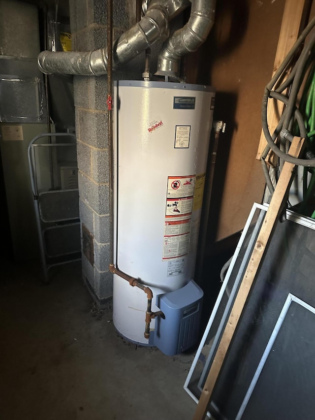 utility room featuring heating unit and water heater