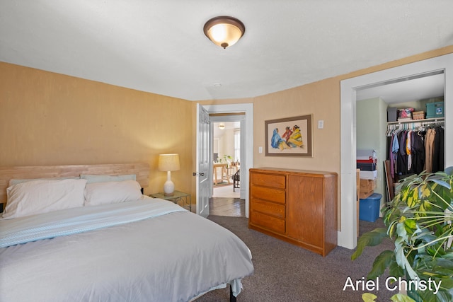 bedroom with carpet and a closet