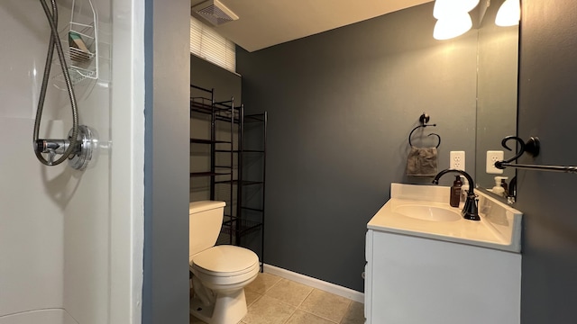 bathroom featuring visible vents, baseboards, toilet, tile patterned floors, and vanity