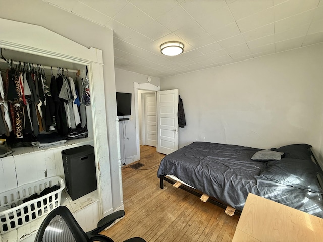 bedroom featuring a closet and wood finished floors