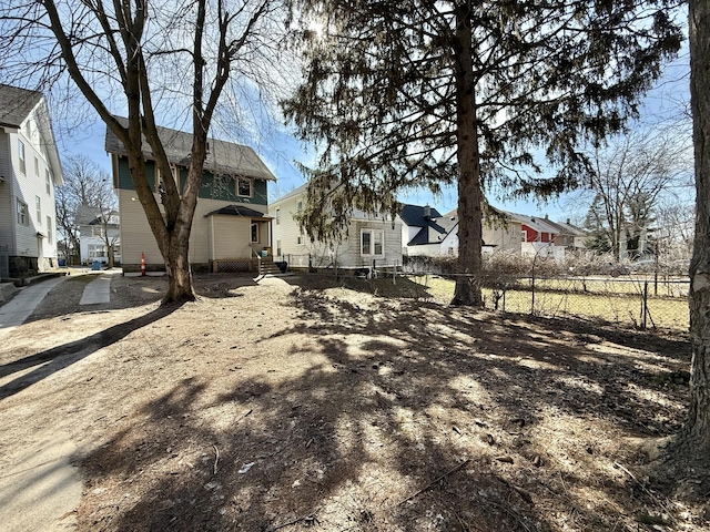 view of yard featuring a residential view and fence